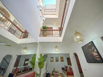 a living room with vaulted ceilings and skylights at Riad Louzaia, Marrakech in Marrakech