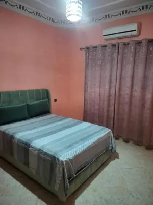 a bedroom with a bed in a room at house mohamed in Marrakech