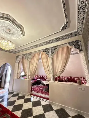 a living room with a bed and a coffered ceiling at flat in Marrakech in Marrakech
