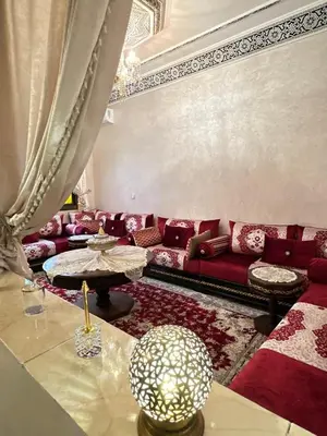 a living room with a couch and a table at flat in Marrakech in Marrakech