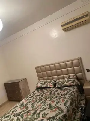 a bedroom with a bed in a room at Secure luxury apartment in Marrakech