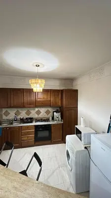 a kitchen with a dishwasher and a washer in it at Secure luxury apartment in Marrakech