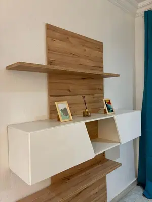 a white shelf in a room with two pictures on it at the wonder of Marrakesh in Marrakech