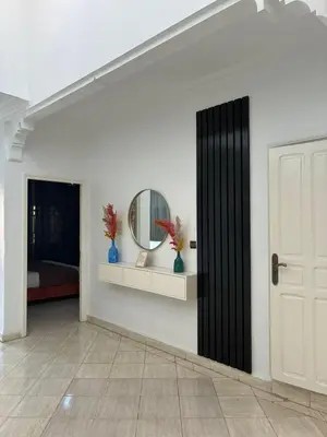a room with a door and a mirror on a wall at the wonder of Marrakesh in Marrakech