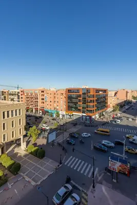 an aerial view of a parking lot in a city at palace studio gueliz et proche gare central in Marrakech