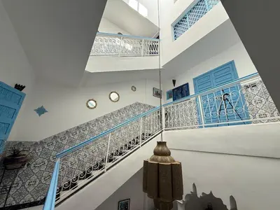 a staircase in a house with blue and white tiles at Calm & Authentic in Marrakesh in Marrakech