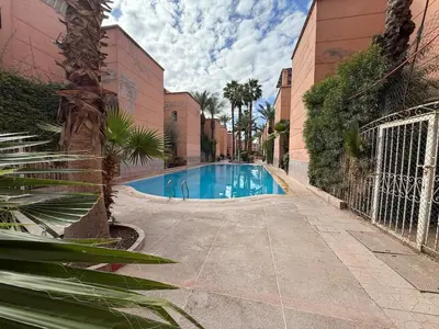 a swimming pool in the middle of a building at Calm & Authentic in Marrakesh in Marrakech