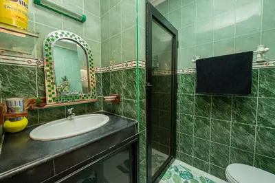a bathroom with a sink and a mirror at DarSaouiri55 in Marrakech