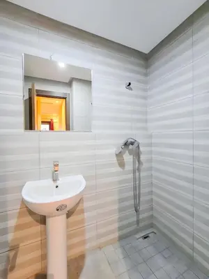 a bathroom with a sink and a glass shower at Burj Malak Duplex Villa Serenitas in Marrakech