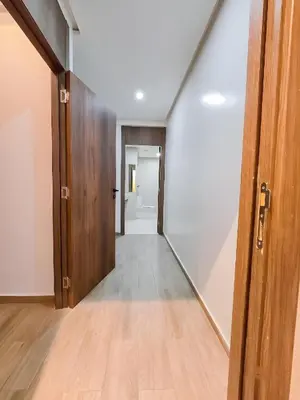 an empty hallway with a door leading into a room at Burj Malak Duplex Villa Serenitas in Marrakech