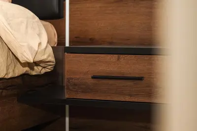 a nightstand with a wooden drawer with a black top at Haven Cosy avec Piscine in Marrakech