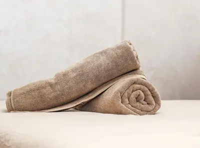 a towel sitting on top of a table at Haven Cosy avec Piscine in Marrakech