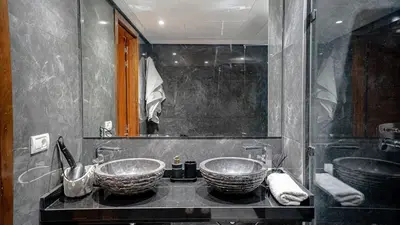 a bathroom with two sinks on a counter at Appartement moderne terrasse avec baignoire privée in Marrakech