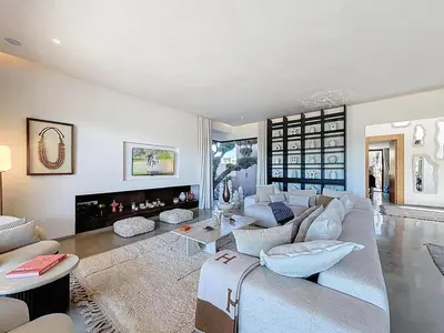 a living room with a couch and a fireplace at Ville d'Exception Marrakech in Marrakech