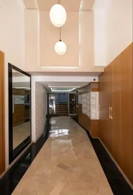 a hallway in a building with a hallway at Appartement Luxe Gueliz Piscine & Spa in Marrakech
