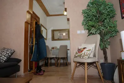 a living room with chairs and a potted plant at Calm Spacious Family Apartment Close To Coty in Marrakech
