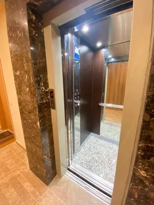 a shower with a glass door in a bathroom at Small Cosy & Balcon & Vue Palmier et Montagne in Marrakech