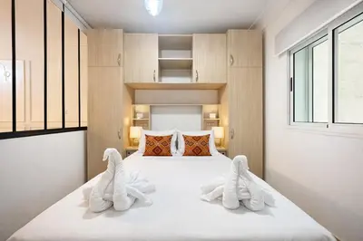 a bedroom with a bed with towels on it at Marrakech-Central studio in Guéliz - WiFi, Netflix in Marrakech