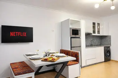 a kitchen with a table with a plate of food on it at Marrakech-Central studio in Guéliz - WiFi, Netflix in Marrakech