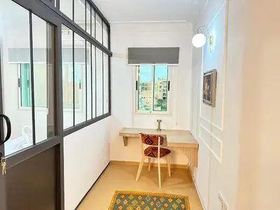 a home office with a desk and a window at Marrakech-Central studio in Guéliz - WiFi, Netflix in Marrakech