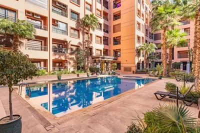 an image of a swimming pool in a apartment building at Cocon Ocre Pool and Balcony in Marrakech