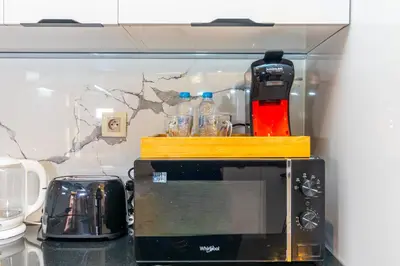 a microwave sitting on top of a counter at Elegant Guéliz Apartment in Marrakech
