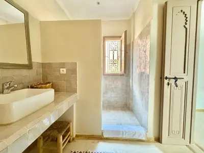 a bathroom with a sink and a shower at Maison Remedy et Spa Private Pool & Breakfast in Marrakech