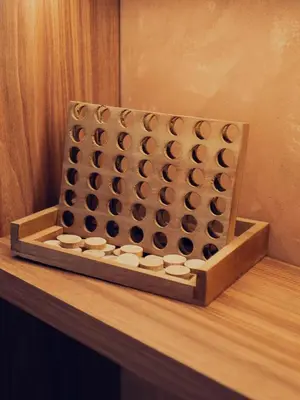 a wooden board with an olympic chess game at LA VILLA 58 - Ecolodge - Marrakech in Marrakech
