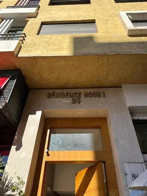 a facade of a building with a reference module on it at Nour in Marrakech