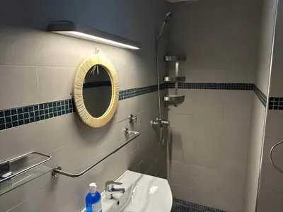 a bathroom with a sink and a mirror and a shower at Nour in Marrakech