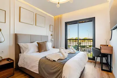 a bedroom with a bed and a desk and a window at Marrakesh, Noria Residence, Luxury 1BR, Atlas View in Marrakech