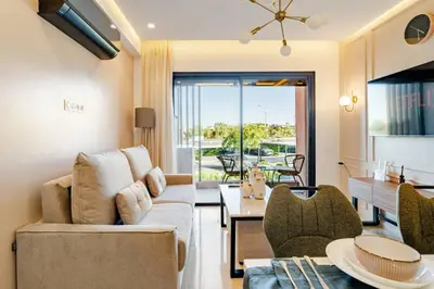 a living room with a couch and a table at Marrakesh, Noria Residence, Luxury 1BR, Atlas View in Marrakech