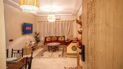 a living room with a couch and a table at le 26M in Marrakech