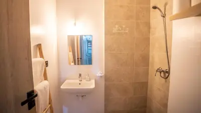 a bathroom with a sink and a shower at le 26M in Marrakech