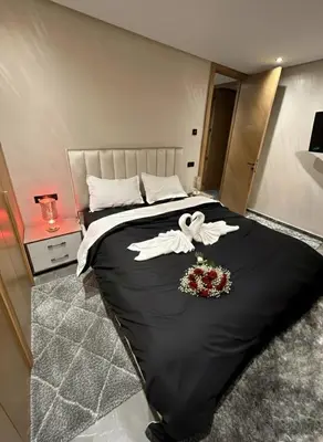 a bedroom with a large bed with flowers on it at Apartment in heart of Marrakech near Guéliz & Medina in Marrakech