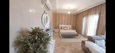 a large living room with a bed and a couch at Atlantic Villa in Marrakech