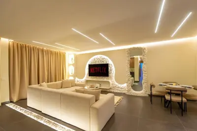 a living room with a couch and a table at Exceptional Apartment Overlooking Marrakech Train Station in Marrakech