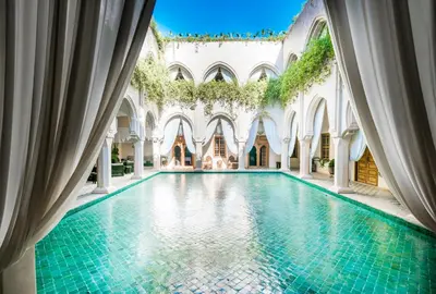 an indoor swimming pool in a building with a tile floor at Almaha Marrakech Restaurant & SPA in Marrakech
