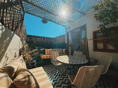 a patio with a table and chairs on a patio at Kasbah Djellaba pool breakfast city center in Marrakech