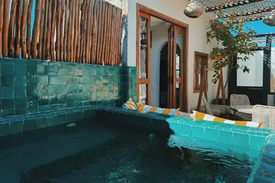 a swimming pool in the middle of a house at Kasbah Djellaba pool breakfast city center in Marrakech