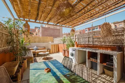 a rooftop patio with a pool on a building at 3BR Gueliz , Rooftop Heated Pool , 10 min Jamaa el Fna, in Marrakech