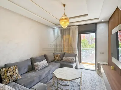 a living room with a couch and a table at Séjour chic au cœur de Marrakech in Marrakech