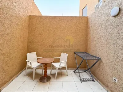 a table and two chairs on a patio at Séjour chic au cœur de Marrakech in Marrakech