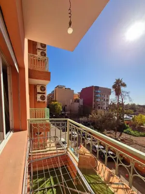 a balcony with a view of a city at Appartement centre ville Gueliz in Marrakech