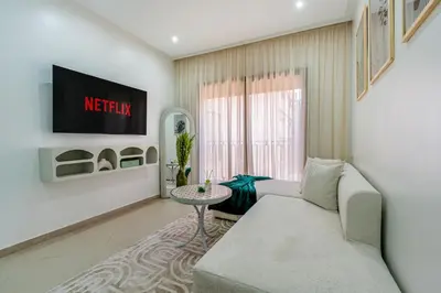 a living room with a couch and a table at Studio élégant et paisible au cœur de Marrakech in Marrakech