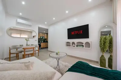 a living room with a couch and a table at Studio élégant et paisible au cœur de Marrakech in Marrakech
