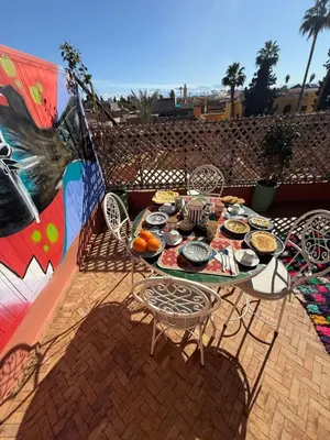 a table with food on it on a patio at Riad R Art in Marrakech