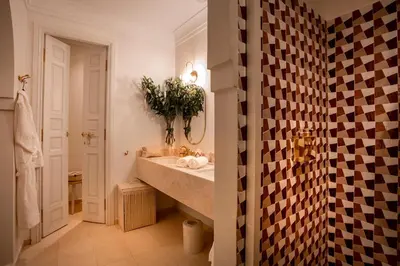 a bathroom with a sink and a mirror at Riad Anaqa in Marrakech