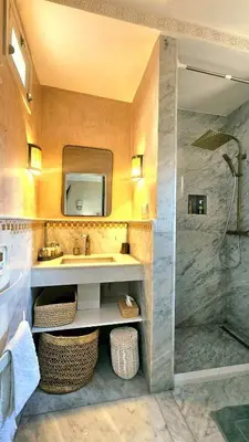 a bathroom with a sink and a shower at Douiria des Loulous in Marrakech