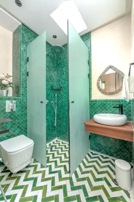 a bathroom with a shower and a toilet and a sink at Riad Garden View in Marrakech